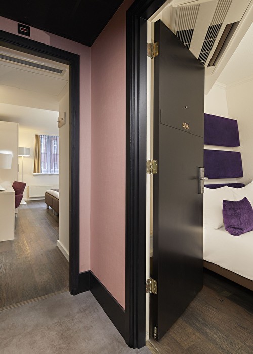 a view of the bed in the family room with connecting doors